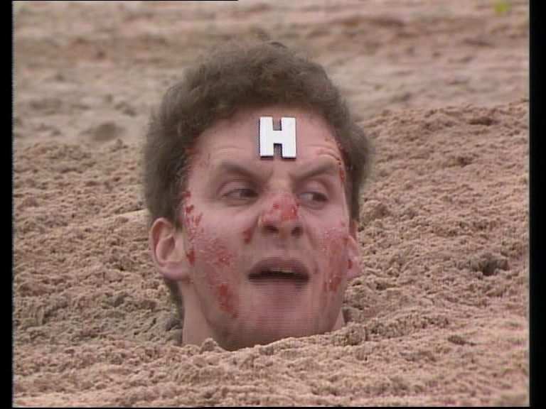 Red Dwarf head in the sand