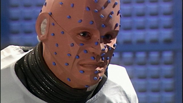 Kryten with blue tack on his head