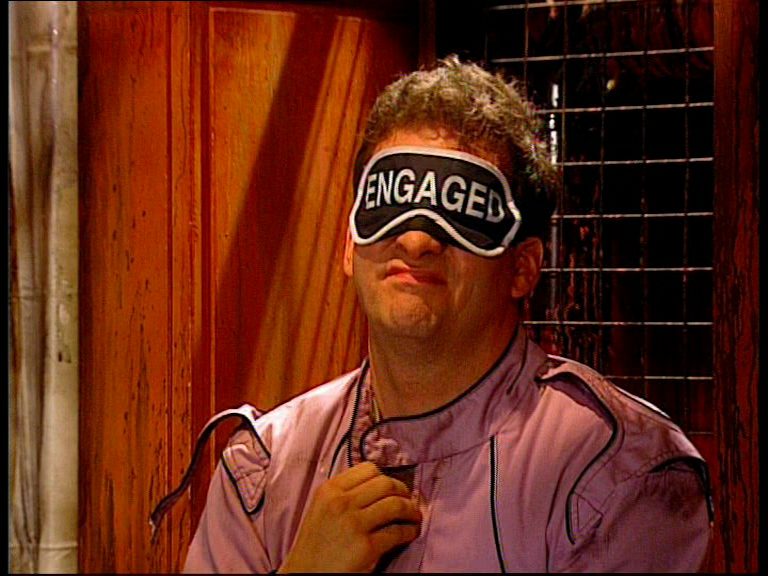 Rimmer wearing an engaged mask